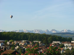 The view from our balcony. Hot air ballooning seems to be a popular hobby in Switzerlandd