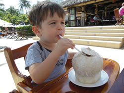 Gabriel enjoys coconut juice