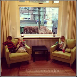 The the three little expats. Our new home has a window looking out onto a cobbled street- a far cry from our US cul de sac!