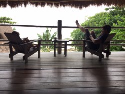 My daughter and husband reading in our villa at Nikoi Island.
