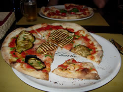 Or you can stay on the cheap and opt for a pizza—like this one with cheese, tomato and eggplant. 