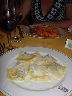 Or you can keep it simple, and order a traditional pasta, like this ravioli with porcini mushrooms or pasta con pomodoro—with cheese, please! 