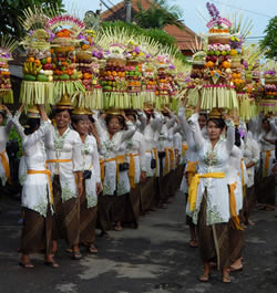 Women taking offerings to the temple