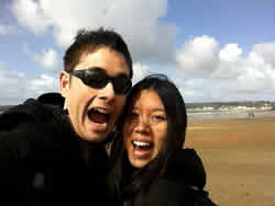 Cheylene and boyfriend on a windy St. Aubins Bay, UK Channel Islands