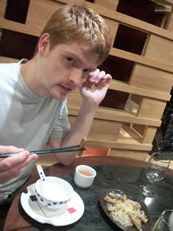 Me enjoying a dish of duck's tongue, the last is a street scene from Yau Ma Tei, where I live