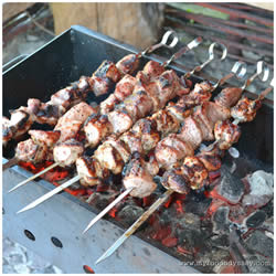 Traditional Lithuanian šašlykai - marinated meat grilled over a fire of birch wood.
