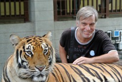 Posing with a little cat at Tiger Kingdom, outside of Chiangmai.