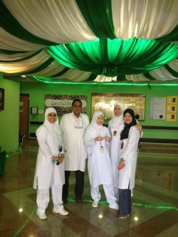 In the portico of Al Muwayh Hospital on Saudi Arabia National Day with Filipina Nurses