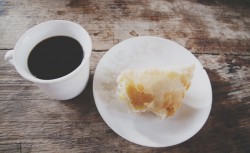 Typical breakfast, delicious and doughy empanadas with black coffee.