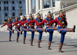 The Mongolian National Color Guard marches in rhythm.
