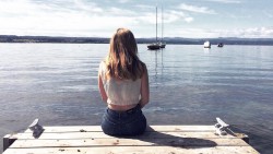 Josie sitting overlooking Lake Taupo